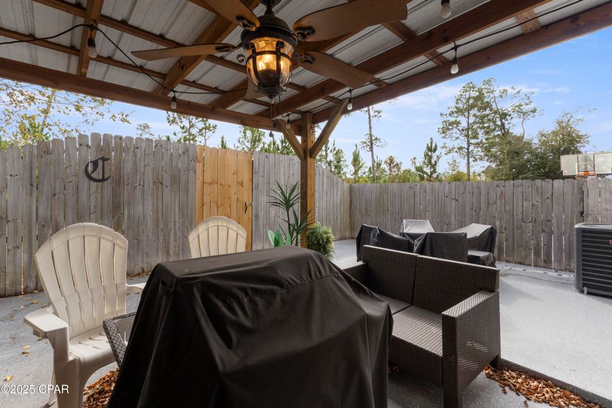 NEW PRICE REDUCTION! This much-loved Lynn Haven home is move-in ready for YOU! Offering 4 bedrooms and 2 full baths. First floor master bedroom, with ensuite nicely updated, Double sinks, bathtub, a separate walk-in shower, and a generous size walk-in closet. Glamorous new lighting is a plus! Three additional spacious bedrooms upstairs.  
The kitchen has attractive neutral cabinets and Corian counter tops, New Stainless-Steel Appliances, a Double oven, updated lighting, pantry and a breakfast bar with barstools.  The dining room easily seats 6 people.  This flows nicely to the comfortable large living room., which has new hardwood floors adding to the warmth of this special home. From this area you can walk out to a screened porch that opens to a Beautiful, private, fully fenced patio.  The back yard area has attractive newer epoxy concrete. No grass to mow! A good-sized laundry room and a 1-car garage round out this truly well cared for home!  
Large, unexpected additional dry storage space in the walk-in attic, is a bonus! This home many updates, New HVAC unit, new hard- wood floors in living room, freshly painted along with crown moldings, and 9-foot-high ceilings.  Newer ceiling fans in all bedrooms, even all new doorknobs, and switch plates have been added! 
Conveniently located close to shopping, restaurants, and schools. 20 minutes to Tyndall Air Force Base .30 minutes to Panama City Beach.  Don't miss this very charming townhome!