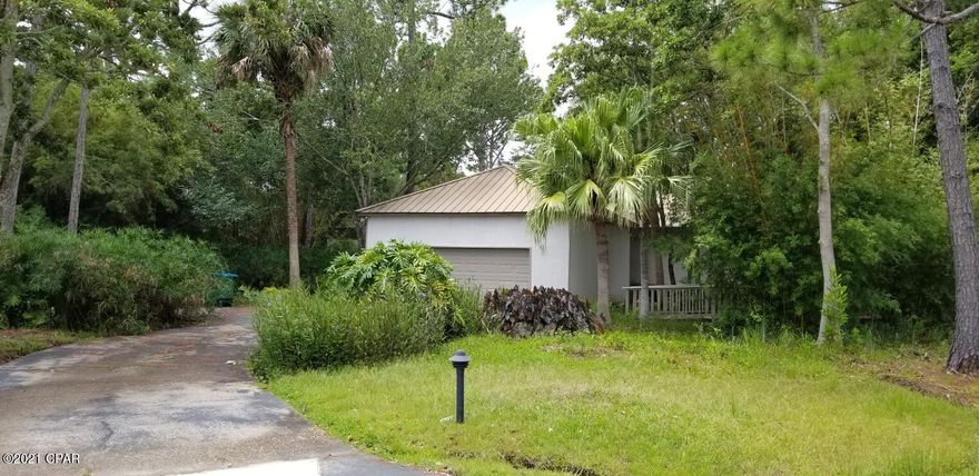 'CURRENTLY UNDER CONTRACT, SELLER ACCEPTING BACKUP OFFERS'  This is a one of a kind home in The Glades  nestled under the trees. There is a large skylight over the sunken living room allowing the sun to shine in on this unique home. Just off the living room is a covered and screened patio that opens to a completely private  screened pool deck. The Glades is a well established neighborhood conveniently located for shopping, entertainment and our beautiful beaches.  The house has not been occupied by the owner for some time and is a ''fixer upper'' being sold AS IS.