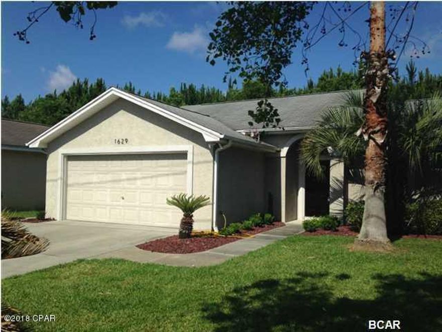 Charity Village home with a pool.  This 3BR/2BA home is centrally located with easy access to Front and Back Beach Roads. Low maintenance, no HOA, open floor plan, split bedrooms, chair rails and stained concrete floors throughout the kitchen and living area. Back door provides access to an enclosed porch and cool decking all around your own (heated) lap pool.  All info is approx. and must be verified by Buyers if important.