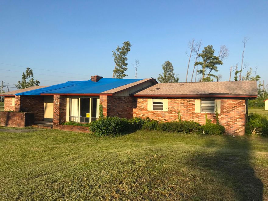 AMAZING fix & flip or investor opportunity here with this gorgeous 3 Bedroom / 2.5 Bathroom large home in a highly sought-after neighborhood in Lynn Haven! This home sits on large corner lot with a PRIVATE POND! It is 2,446 sqft. (heated) and 3,250 sqft. (total). The home has a shed that could be used as an extra garage, RV port, private well, septic, and a lot of storage space. The interior has a some great vinyl wood floors, fireplace, kitchen island, garden tub in the master bath, and some other great features! The home will need repair after Hurricane Michael and require roof work, drywall, etc. - but the home has already been dried out and has limited mold. Act quickly because this property WILL NOT LAST LONG!     ----- CASH BUYERS ONLY -----