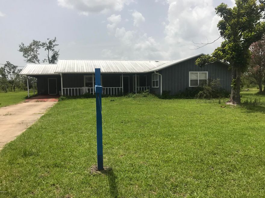 This is a great home or a perfect getaway home with space to have a garden and enjoy living away from the City Life. This 2000+ sq Ft House with 3 bedrooms, 2 full baths and an additional 16 X 13 ft room. Comes with Refrigerator, Stove/Range, Dishwasher, Microwave, Washer and Dryer. The House is equipped with a gas powered whole house Generator. It sits on 2+ acres of land and on a Dead End road. It has two Wells and a Pond close to the house.  The house also has two covered porches, and separate workshop/storage building.  it also has a septic system.  and a single car carport.  This House cannot Close before August 17th 2019.