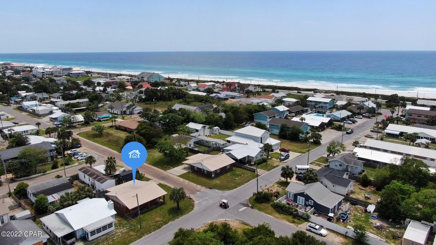 Relax with the Old Florida Charm of this 2 bed 2 bath brick house 800 feet from dedicated Laguna Beach. Enjoy as a tranquil getaway to make lasting memories at the beach or a lucrative rental investment. Short term vacation rentals allowed and there is no HOA. Walk 1 block and you are on the naturally beautiful path over the dunes to the incredibly soft, white sugar sand and the revitalizing surf of the emerald gulf water. This property is a true beach gem with Florida cottage charm. Appreciate your days at the beach and then relax under the long covered front porch enjoying the breeze and calm Laguna Beach Lifestyle. Verify measurements and important information.