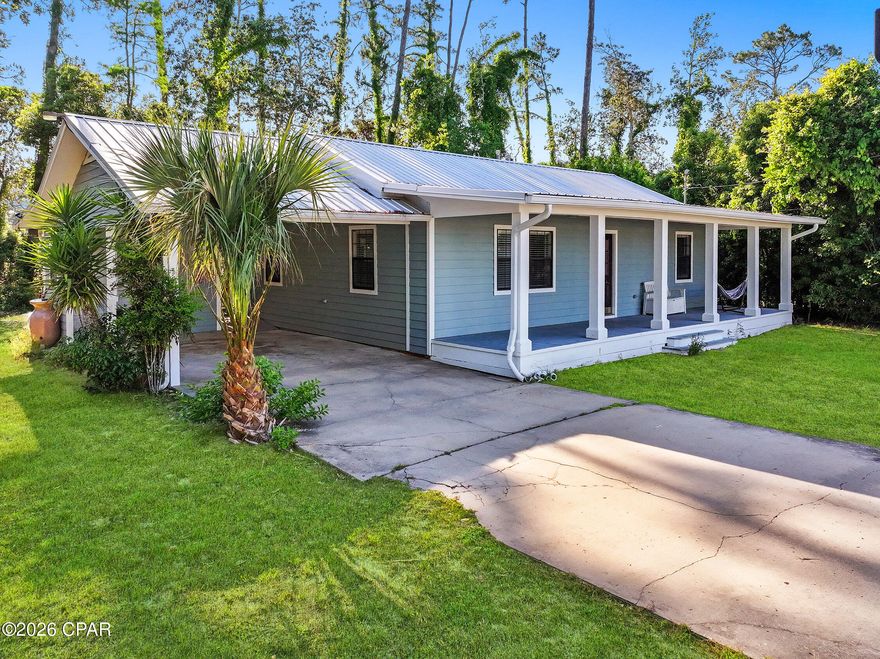 CURRENTLY UNDER CONTRACT, SELLER WILL CONSIDER BACKUP OFFERS - - - - - - Newly remodeled and move-in ready, this charming home situated on two parcels totaling approximately .65 acres, including the additional lot 03060-020R, this property provides extra privacy, room to expand, and endless possibilities.  From the moment you arrive, you'll love the inviting curb appeal featuring a spacious covered front porch--perfect for relaxing with your morning coffee. Inside, the home features bright open living spaces, and plenty of natural light. The remodeled kitchen offers abundant white cabinetry, stainless steel appliances, ample counter space, and a seamless flow into the living and dining areas--ideal for both everyday living and entertaining.  The home also features generously sized bedrooms, updated bathrooms, and a functional layout with plenty of storage. An oversized covered back patio adds even more room to enjoy outdoor living, host guests, or unwind while overlooking the expansive yard.  With no HOA, you'll enjoy added flexibility and freedom.  Located just minutes from Port St. Joe's beautiful beaches, boat ramps, schools, shopping, and downtown dining, this newly remodeled property is an excellent opportunity for a primary residence, vacation getaway, or investment property with additional land included.