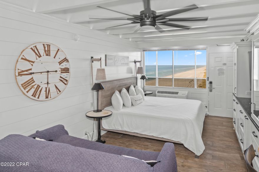 This astounding Gulf front getaway is meticulously renovated with purpose and style.  Shiplap walls, custom high end shaker-real wood cabinets, electric mirrors, and textured countertops appeal to the most design conscious buyers.  Bosch appliances including an induction oven and a wine refrigerator give the kitchen a luxurious, sophisticated feel.  A built in, one of a kind multi purpose table, stylish farmhouse chairs, custom sliding barn door, wood look tile floors, and coastal decor contribute to the beach-modern-farmhouse look.  The sound bar does not stay with the property.