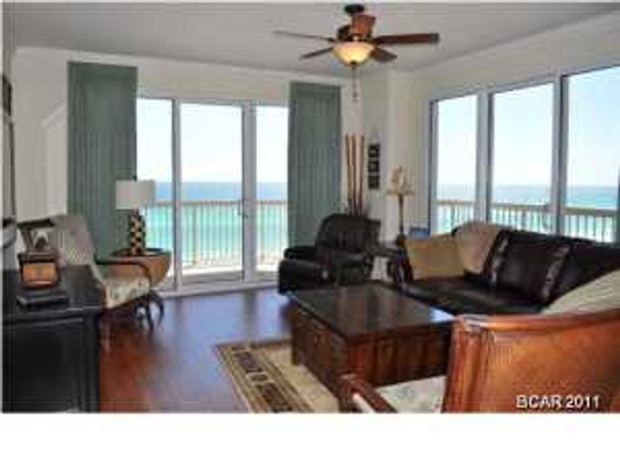 You'll enjoy the panoramic views of the Gulf Of Mexico from this extravagant Sunrise Beach unit. This is the best unit in the complex; not too high, not too low and has a wrap-a-round balcony for the best views on the beach. The interior of the unit features a split-bedroom floor plan and the seller added many upgrades including hand-sculpted wood flooring in the living room, 18-inch ceramic tile, and crown moulding. This unit also has a separate storage unit next to the elevators. Sunrise Beach offers its residents hundreds of feet of dedicated beach, covered parking garage under the building, on-site gym, two pools and hot tubs, and children's water play area. You're also walking distance to many restaurants and just a 3 minute drive to Pier Park. All info is approx and must be