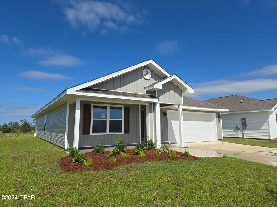 New construction home located at 5025 Windrow Way in Titus Park. This home is is situated on an exterior lot. As you enter this 4 bedroom, 2 bath home, you will see 1,799 square feet of spacious living. Inside you will see 8' ceilings throughout, engineered vinyl plank flooring throughout the main areas, and soft carpet in the bedrooms. Beautiful laminate countertops, white cabinetry and a spacious open living room and kitchen make this home perfect for having guests over. The kitchen has a large center island with cabinets underneath, ideal for serving food and extra storage. The kitchen also has a spacious pantry, and the stainless-steel appliances include smooth top range, microwave, and dishwasher.

The primary bedroom has soft carpet and its own bathroom featuring a spacious walk-in closet, a double vanity with laminate countertops, and a separate shower and tub. Welcome to Titus Park, a new home community in the lovely Panama City, Florida. Located right off Highway 231, it is conveniently located close to shopping, food, great schools, and not far from Tyndall Air Force Base. Across the street from Titus Park, you will notice that a large grocery store just opened, making it convenient to grab what you need without traveling far from home. You also will be close to 23rd street in Panama City, which has a multitude of shopping, food, gyms, and more.