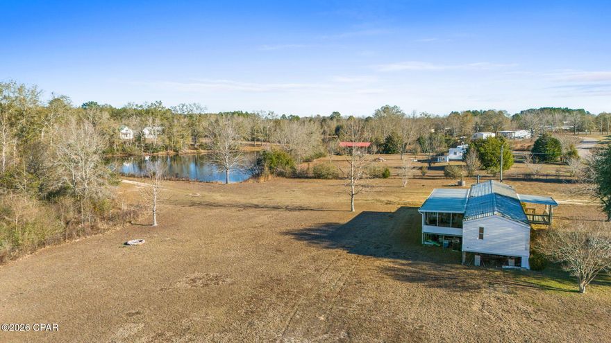 Land, Water & Opportunity - 2.67 Acres in Bonifay Rare opportunity to own 2.67 private acres featuring a semi-private fishing pond, wide open space, peaceful country views, and incredible sunsets. This property offers the kind of privacy and freedom that's getting harder to find. The 1999 3-bedroom, 2-bath manufactured home is being sold AS-IS and will require finishing updates -- making this an ideal opportunity for a cash buyer, investor, or DIY purchaser looking for land with improvements and the ability to add value. The home includes a covered front porch and screened back porch, perfect for enjoying nature and watching wildlife. The roof was replaced approximately six years ago. Property is served by a private well, offering independence and lower utility costs. A certified survey has already been completed. With plenty of usable acreage, there is room for RV parking, gardens, workshops, recreational use, or even building your future dream home while utilizing the existing structure.
Conveniently located near Hwy 79 and I-10, approximately 50 minutes from Panama City Beach. If you've been searching for land, water, and potential - this is a rare chance to secure all three at an accessible price point.