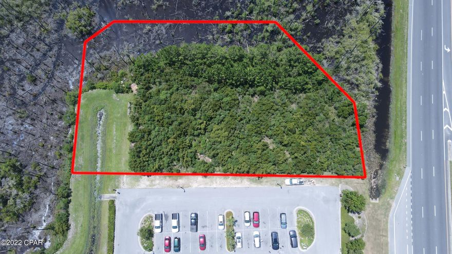 Prime Commercial lot almost pad ready on one of the busiest roads in extremely fast growing Panama City Beach. 

Just over 1.1 acres. 

Comes with shared parking  and also has   extra room to add additional parking if needed. 

Power electric box is next to property and water retention is already complete for the entire parcel. 

Has  turning lane into property. 

Sewer and power ready.