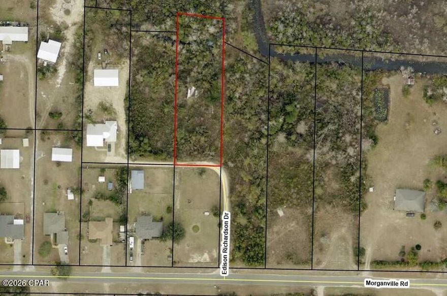 .61 Acre lot on a private road with easement offered as is.  the lot back up to canal with fresh water access to Bear Creek.