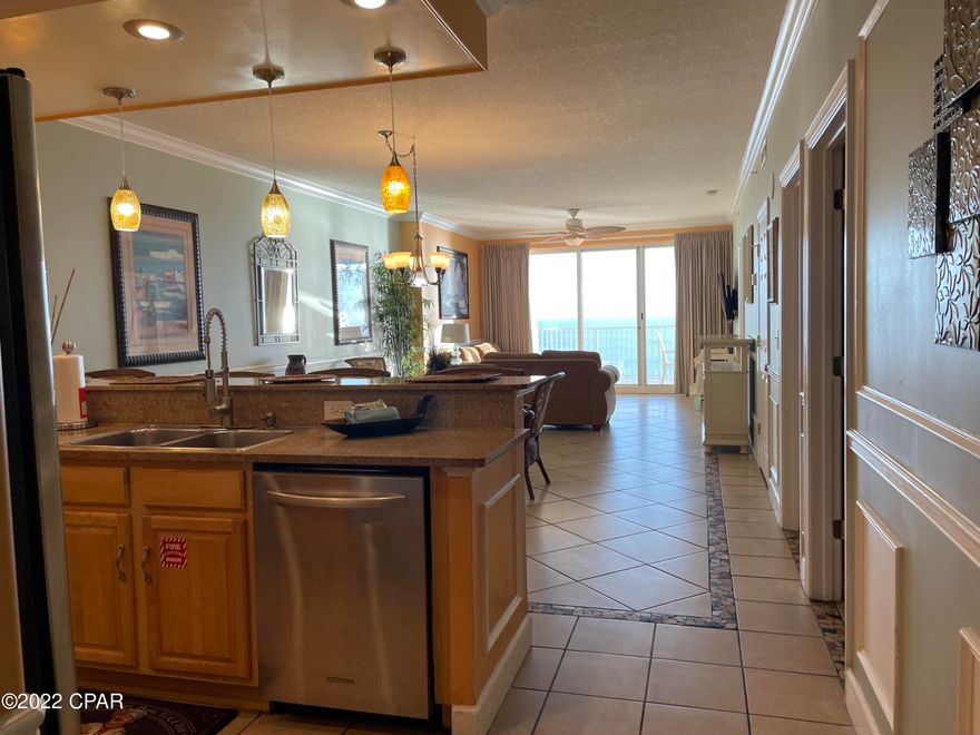 Wow! This amazing 4 bed/3 bath Gulf front corner unit at desirable Ocean Reef is a must see! INVESTORS : Approx. $75k GRI in 2024. Enjoy the beautiful beach views from your super large balcony (10x24 approx.) Many upgrades!  Custom designed foyer floor tiles.  No Carpets! Also, custom walk in shower in master bath.  Kitchen has been updated with stainless steel appliances And a Beautiful custom built trey ceiling with recessed lights has been added. New refrigerator 2024. Custom Crown Molding throughout.
Ocean Reef amenities include; beach front pool, fitness room, sauna, heated pool & BBQ grills.  Located close to Pier Park, shopping, restaurants Call today!  All sizes approximate.