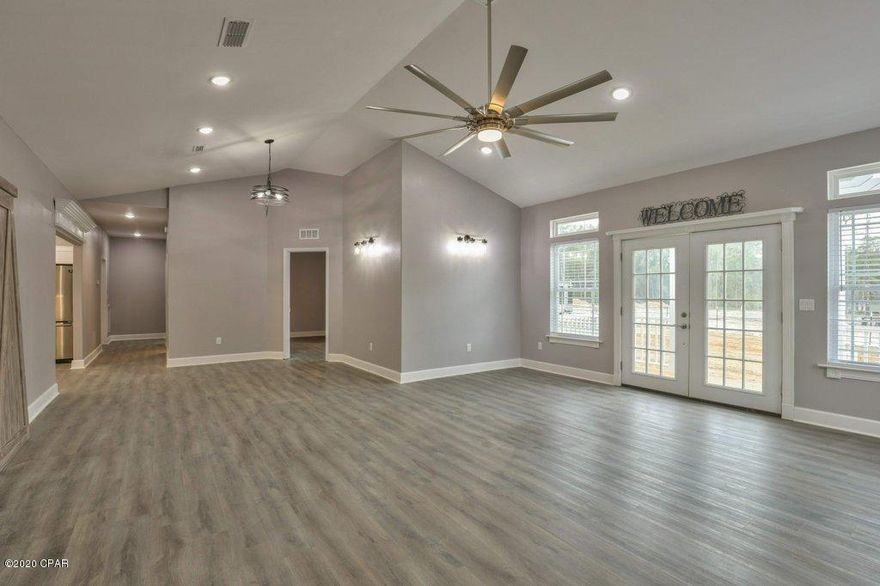 CURRENTLY UNDER CONTRACT, SELLER ACCEPTING BACKUP OFFERS.  Amazing new construction under $200k.  Everything new and done professionally by Dick Stanley Construction!  This home features a large front porch that wraps around side of home to French doors.  Inside the front door in the living room you will find a dramatic vaulted ceiling reaching up to 21 feet.  Also in living room is a Heatilator electric fireplace that is efficient as well as beautiful.  Double barn doors open up from the living room to the third bedroom/office area.  Through the living lies the large kitchen with an abundance of cabinets.  All new stainless energy star appliances are in the kitchen and there is plenty of countertop space for a group to prepare meals. Second bedroom has access to the second bathroom from the bedroom.  Farther down the hall is a very large inside utility room that has plenty of space for extra storage along with a 50 gallon water heater.  The master bedroom features a gigantic 10x12 walk in closet that has attic access to a finished storage room above.  The master bath has light fixtures that you can change the colors on as well as blue tooth speakers built in.  One of the things that you will notice about the exterior of the house is very clean lines and low maintenance design.  The siding is a heavy duty 40 year vinyl plank that should only need the occasional spraying down.  The level lot is fenced and has plenty of open space for your garden or storage shed.  Check with your lender today to see if you can't purchase this brand new home for less than you are renting for.