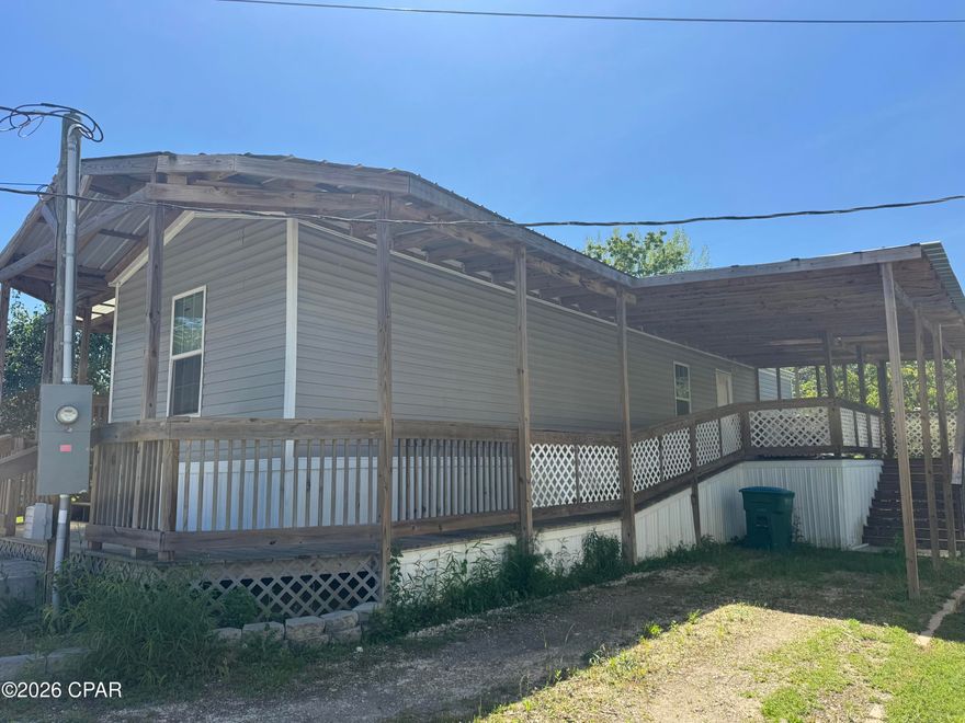This property has a wraparound front and side covered deck / porches. Location is key with this two-bedroom, two bath Mobile Home. It is within walking distance to everything. It has been a rental in the past and has been very well maintained. You will love the porches, lots of room to enjoy grilling and just relaxing. Perfect for the person that is busy and doesn't want to maintain a big property.