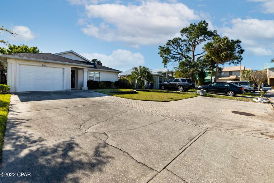 CURRENTLY UNDER CONTRACT, SELLER ACCEPTING BACKUP OFFERS You're going to love this charming home in Venetian Villa!! The 3 bedroom 2 bath home has a split floor plan with a ton of extras. The interior features new vinyl plank flooring, a new hurricane rated garage door and opener, a new water heater, and a new front door and new patio doors. The exterior of the home has countless features you're going to love as well. The roof was replaced in 2019 and new gutters were installed as well. The huge screened in patio is set up perfectly for entertaining. There is an attached outside storage area with plenty of room for a lawnmower that frees up space in the garage. One of the best things about this home is all the extra parking!! There is a professionally installed paver driveway that provides plenty of off street parking. Make sure you check this one out today!