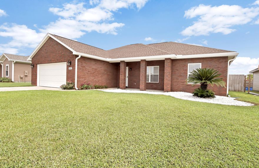 Quality built with custom features! This solid brick home has a spacious, open layout with a split bedroom floorplan. Some of the custom touches include bull nose corners, decorative wainscoting, paneled doors, upgraded fixtures, faux wood blinds, and wiring for surround sound.  The kitchen has upgraded cabinets, solid surface countertops, ample cabinet space and a pantry for extra storage. The breakfast bar is a great place to sip your morning cup of joe or visit with the chef.  The master bedroom is of good size and has the perks of a walk-in closet and tray ceiling. The en suite offers a double vanity and separate shower and tub.  Enjoy the backyard with privacy fencing and a screened in patio, where you can watch the kids or pets play, have a get together with friends or just enjoy the shade on a hot day. Sellers left a cocktail fruit tree and all lawn equipment for the buyer! Located in the popular Cherokee Heights neighborhood, this home is out of the hustle and bustle of traffic but close enough for a quick drive to town.  This home has had excellent rental history and could also be a profitable investment opportunity.  New roof, new carpet, new fence, new water heater and home comes with pre-fit plywood window covers for the hurricane season! Sellers are offering a one-year home warranty for buyers peace of mind. Measurements approximate, buyer to verify if important.