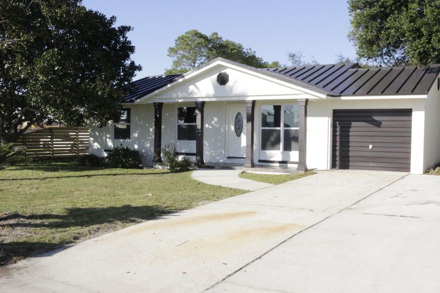 This house has been completely remodeled from top to bottom! It's a perfect beach house only a couple streets away from the Gulf of Mexico. Put your golf cart in the redone garage and drive down to the beach whenever you want! This home features a new top of the line standing seam metal roof along with a new fridge, stove, range hood, air conditioner, windows, counter tops, water heater, toilets, and a newly tiled shower. 















All measurements are approximate and should be verified by the buyer.