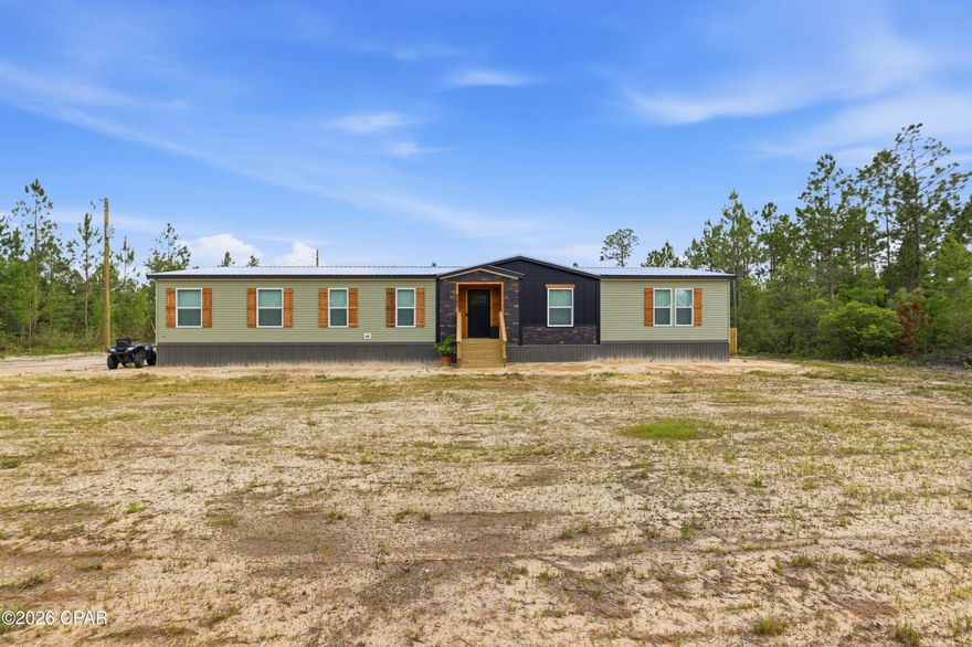 10 private acres in Altha featuring a 2025 Helicon 3.0 manufactured home, permanently affixed, detitled, and classified as real property. This 4BR/2BA home offers 2,280 sq ft with a split-bedroom floor plan, full drywall interior, linoleum flooring throughout, electric fireplace, real wood soft-close cabinetry, pantry, and dedicated laundry room. Primary suite includes walk-in closet and private bath. New 2025 well, septic, and HVAC. All 2025 appliances convey. Exterior features include cedar handmade shutters, fenced yard, 10x16 shed, and pole barn with separate power pole and breaker box. Plenty of room for livestock, equipment, recreational use, or country living. More photos will be provided soon.