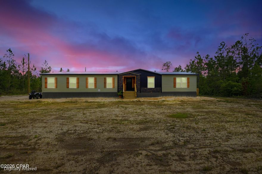 10 private acres in Altha featuring a 2025 Helicon 3.0 manufactured home, permanently affixed, detitled, and classified as real property. This 4BR/2BA home offers 2,280 sq ft with a split-bedroom floor plan, full drywall interior, linoleum flooring throughout, electric fireplace, real wood soft-close cabinetry, pantry, and dedicated laundry room. Primary suite includes walk-in closet and private bath. New 2025 well, septic, and HVAC. All 2025 appliances convey. Exterior features include cedar handmade shutters, fenced yard, 10x16 shed, and pole barn with separate power pole and breaker box. Plenty of room for livestock, equipment, recreational use, or country living. More photos will be provided soon.