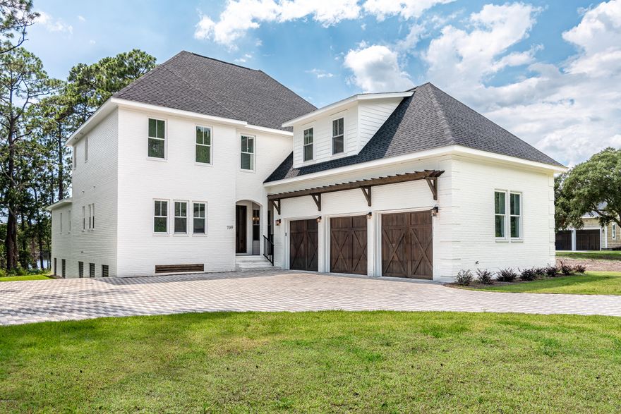 When luxurious style, practical function, and respectful design are in harmony together, a home realizes its full potential. Place that home in the magical setting on the shores of the area's largest Coastal Dune lake, Lake Powell and an awe-inspiring oasis is created.  



This amazing property features a spectacular 6,581 square foot luxury residence and private boat dock. To step into the home is to cross over into a peaceful sanctuary. A well-designed floor plan creates a home to live easily, as well as to entertain either intimate or large gatherings. Grand windows and retractable sliding doors create a seamless transition from the interior of the home to the outdoor living spaces. The main great room is truly grand but offers cozy spaces for quiet conversation, anchored by a gas fireplace with washed brick surround and custom mantle. The kitchen is a striking mix of high-end contemporary cabinetry, top of the line Wolf & SubZero stainless-steel appliances and accents alongside stunning countertops, offering clean lines, ample workspace and excellent storage. The decadent master suite is on the main level with spa-like en-suite, walk-in closets and stunning views of Lake Powell. The upper levels hosts additional guest retreats with en-suite, two bonus rooms provide an ideal location for a media room, exercise room or office space.  

Notable features include: 3-car garage, ½-acre oversized homesite, hardwood flooring, new construction.

Lake Powell is the largest coastal dune lake in Florida and North America covering almost 800 acres and has a channel, known as an outfall, that runs into the Gulf of Mexico. Depending on the tides and winds, saltwater from the Gulf may enter the lake when the outfall is open. Conveniently located at the access to Wild Heron, The Pointe at Lake Powell, is a short drive to Pier Park and 30A.