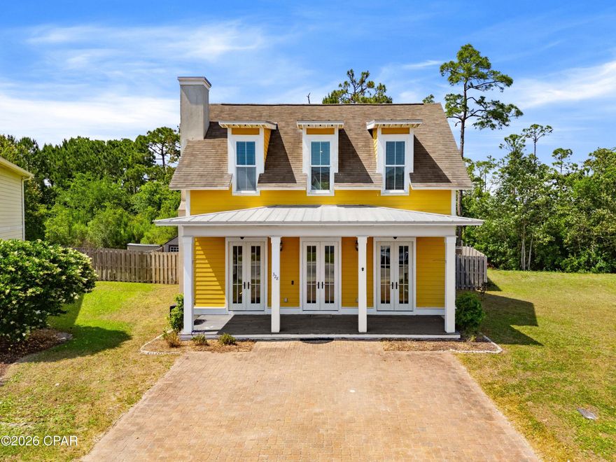 CURRENTLY UNDER CONTRACT, SELLER WILL CONSIDER BACKUP OFFERS

There is a certain ease to life when the beach is just a short walk away, when mornings begin with salt air and evenings settle into a quieter rhythm. This four-bedroom residence in Harrison Walk offers that balance, pairing everyday comfort with a location that keeps the best of Panama City Beach within easy reach.

Inside, the home unfolds across approximately 2,300 square feet with a layout designed for both gathering and retreat. Ten-foot ceilings elevate the main living spaces, where natural light moves easily through an open-concept design. The first-floor primary suite introduces a sense of privacy and convenience, while three additional bedrooms upstairs provide flexibility for guests, family or a dedicated workspace.

Recent updates, including fresh interior paint and new carpet in all bedrooms, create a clean and welcoming backdrop. Finishes throughout feel thoughtfully selected, offering a step above what is often found at this price point and leaving room for a buyer's personal vision to take shape.

Curb appeal sets the tone on arrival, with a covered front porch and brick paver driveway creating a polished first impression. Beyond the home, a community pool adds a relaxed gathering space, while the absence of short-term rentals preserves a more residential atmosphere.

Positioned within walking or biking distance to the beach, the pier and nearby attractions like Shipwreck Island Water Park, this property offers both accessibility and a sense of calm. Priced with intention, it presents a compelling opportunity for a primary residence or second home in a location that continues to draw lasting interest.