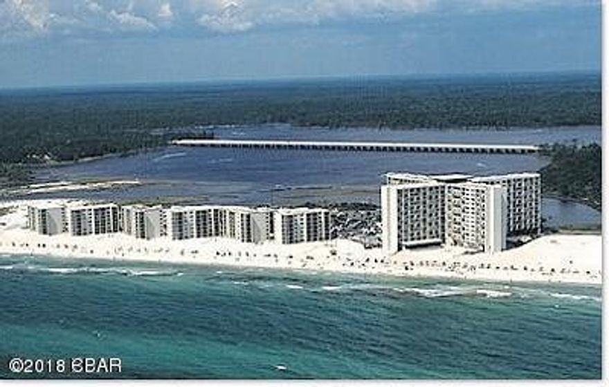 Penthouse two bedroom unit with Coastline, Beach and Gulf views that are like no other!  Updated unit features solid surface countertops, white cabinets, tile flooring, trey ceiling in kitchen/dining area, crown molding, appliances and air handler replaced in last two years; fully furnished and rental ready.  Good rental history with rentals in place thru Labor Day that must be honored. Pinnacle Port Resort is situated on a 25+ acre site within a beautiful gated community having over ¼ mile of beach frontage!  The complex has lots of amenities including two swimming pools, tennis courts sauna/steam room, fitness room, its own private freshwater dock with boat slips boat launch and wi-fi.   Please note that the Association fees include electricity for heating, cooling and hot water. The owner pays a small electricity bill for lighting and appliances only.