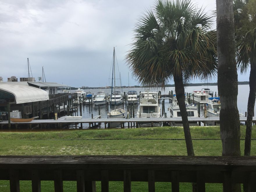 Beautifully decorated, waterfront condo being sold fully furnished. Just bring your clothes and move in! This one bedroom and one bathroom condo over looks the Sun Harbor Marina and the popular Shipyard Grill Restaurant. It has been updated beautifully by the owners and features new laminate floors,stove top and oven, paint, light fixtures and ceiling fans. The master bedroom offers a flat screen TV that has been hung on the wall. This is the only unit for sale in this building and it will not last long!