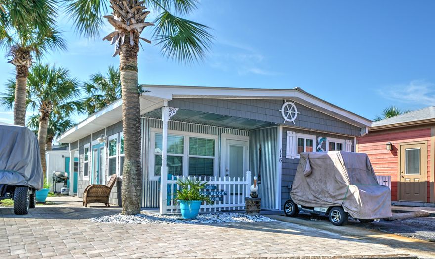 Check out this adorable 2 bedroom 2 bath with bunk room! Located in highly sought after Venture Out at Panama City Beach.  Fantastic recent renovation includes: plumbing upgrade, new vinyl shakes, new windows, front door, roof, cabinets, appliances and much more! Kitchen is open to the living room and the house flows nicely. Home will be sold furnished with a golf cart.  Great potential here for investment or 2nd home. Venture Out has 300' on the beautiful pristine beaches of the Gulf of Mexico and 1,000' on the Grand Lagoon. Venture Out has something for everyone. With two pools, fishing pier, boat ramp, mini golf, children's play ground and much more. All measurements are approximate.