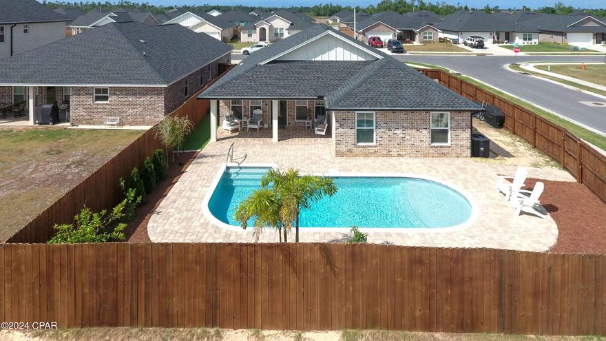 Stunning home in one of the most sought out neighborhoods in Bay County  This All Brick home with spacious Open floor plan, has everything you are looking for with, custom solid wood cabinets, Quartz counter tops, Upgraded light fixtures, doors, Insulation, Trim, Low E windows, Luxury Vinyl flooring, Stand alone tubs, The seller has made many upgrades to this home from garage flooring, gutters, fence, blinds, Cabinets in the Butlers Pantry, security system, and best of all the inground  heated pool and Lush Tropical landscaping. Neighborhood has under ground utilities, lighted streets. Zoysia Grass and landscaping! Let College Station be your next move.... This is the Princeton Floor Plan