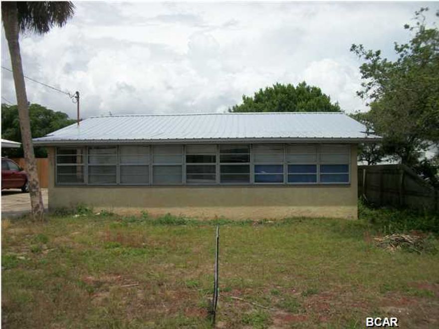 New metal roof, new a/c and heating and duct work. New septic tank two years ago. Your opportunity to create your beach getaway in your own style and design. This property is ready to personalize! Older beach cottage being remodeled. Buy ''as is'' now for $134,900 or ''subject to completion'' for $169,900. Approx. 3 blks from the beach with enclosed and finished porch/Florida room to enjoy the evening breezes. Separate bathroom entrance in back for easy clean up after the beach! Age, sq.footage, room and lot size are approx. Seller is Florida licensed broker.