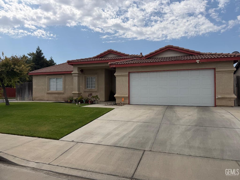 Photo of 5311 Milagro Drive Dr, Bakersfield, CA 93307 (MLS # 202608876)