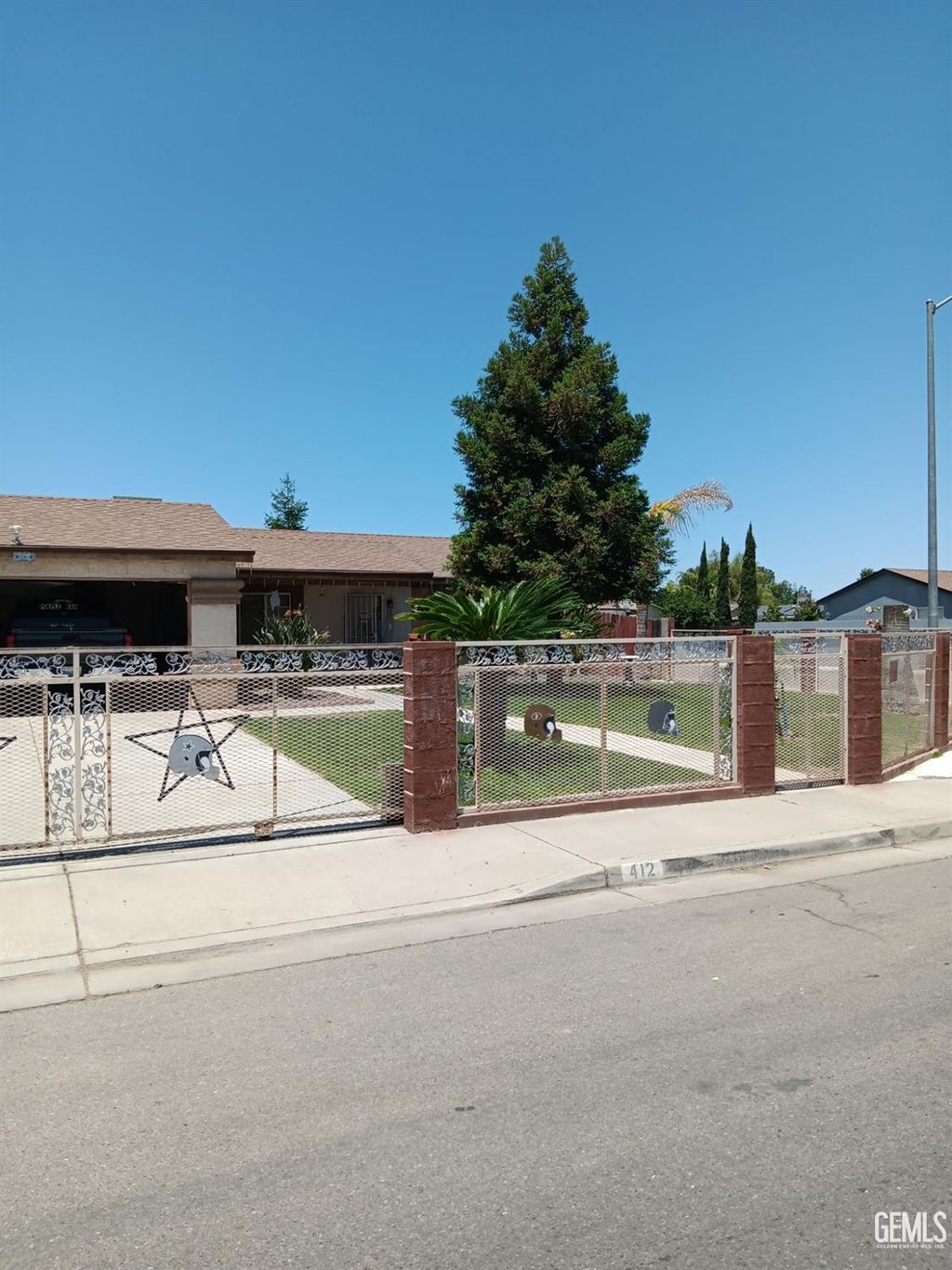 Photo of 412 Leeta Street, Bakersfield, CA 93307 (MLS # 202511004)
