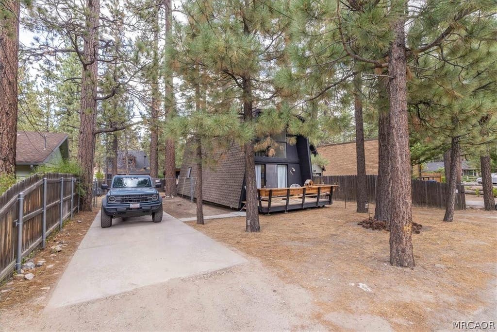 Photo of 909 W Rainbow Boulevard, Big Bear City, CA 92314 (MLS # 32601866)