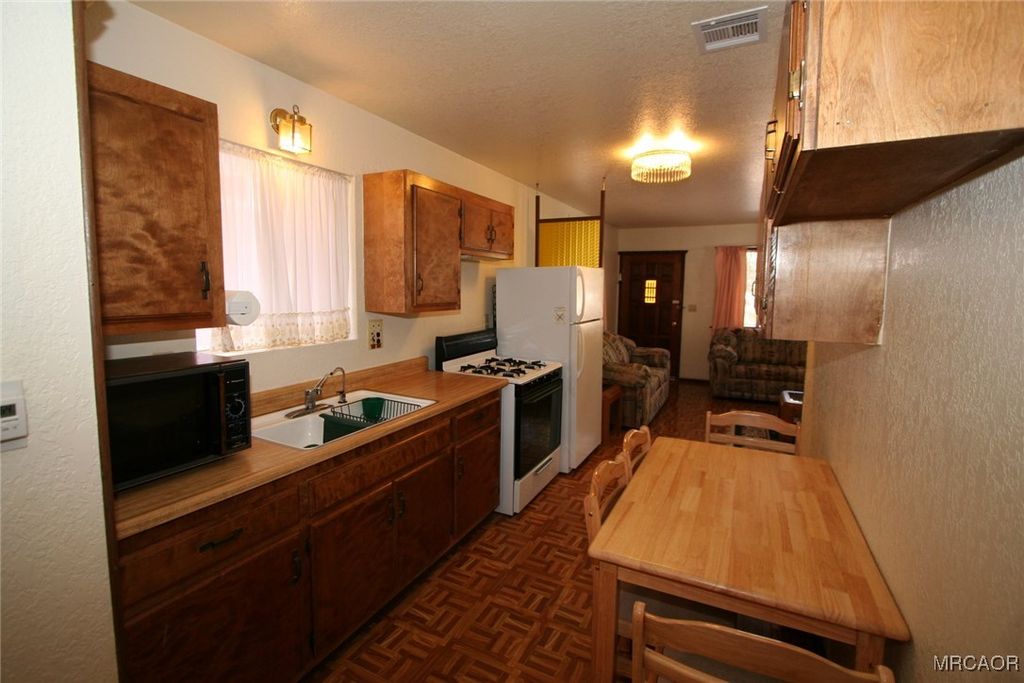 Photo of 441 W Aeroplane Boulevard, Big Bear City, CA 92314 (MLS # 32502503)