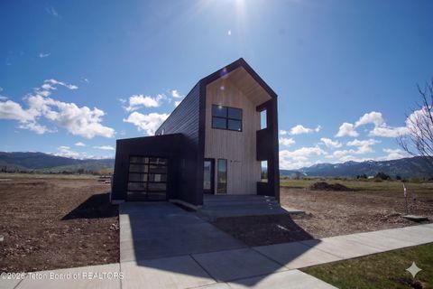 Photo of 8747 WINDY RIDGE Road, Victor, ID 83455 (MLS # 25-2003)