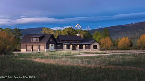 Photo of 7050 FOX MEADOWS Drive, Victor, ID 83455 (MLS # 26-1220)