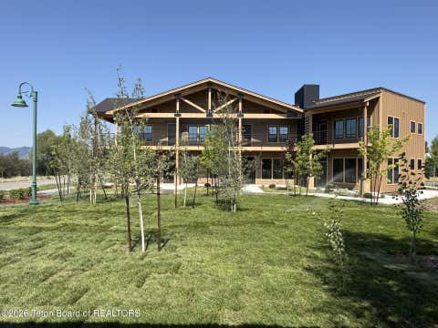 Photo of 9102 VILLAGE Way #104, Victor, ID 83455 (MLS # 26-1199)
