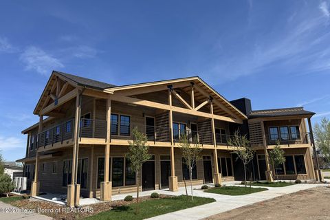 Photo of 9102 VILLAGE Way #104, Victor, ID 83455 (MLS # 26-1199)