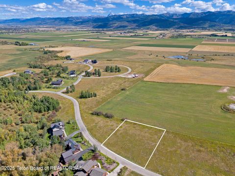 Photo of 9805 Hiddenwaters Lane, Victor, ID 83455 (MLS # 25-2535)