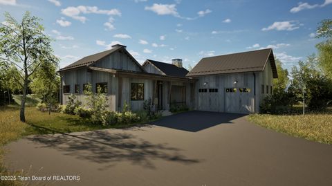 Photo of 880 Mtn Bluebird Court, Driggs, ID 83422 (MLS # 25-2959)