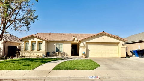 Photo of 1058 W Canyon Way, Hanford, CA 93230 (MLS # 244587)