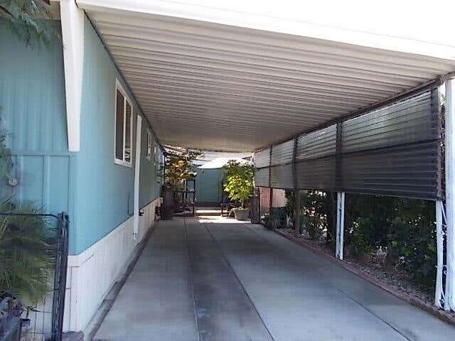 Photo of 2400 W Midvalley Avenue J-01 #J-01, Visalia, CA 93277 (MLS # 242063)