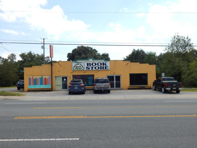 Wonderful corner commercial lot in busy Crestview. Located on Highway 90 West & Kit Dr. The building is currently a profitable used book store. The business and inventory can be purchased with the real estate if so desired. The building is set up and ready for businesses. There is 3780 total square feet under roof. The book store side is approx. 2400 sf and the other vacant side is approx. 1300 sf. The 2 units are separated by a firewall built to code. Both sides have a new HVAC system and are ready to go. The smaller unit was occupied as a salon with multiple outlets, water etc. and was rented for $750 per month. The building has a newer roof in place that was $24,000. This is a unique opportunity & very little expense to be right on HWY 90 and close to Downtown Crestview.