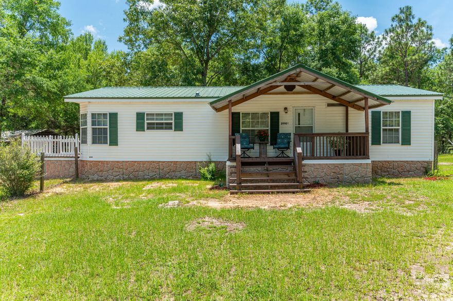 BACK ON MARKET, NO FAULT OF THE PROPERTY !  '5 ACRES' - OnLy 7 miles to town !  33 Miles to Eglin AFB~25 Miles to 7th SFG * Come relax on the covered porch of this charming 3 bedroom, 2 bathroom home and enjoy the Peaceful Private  5+/- acres of beautiful land. This home features a spacious open concept, split bedroom plan including a spacious living room and adjoining dining area. The Kitchen has Brand New Appliances (2024) Hood Fan (2023) New Kitchen Flooring (2024) including a Breakfast Nook Area. These Major Upgrades have been done for you. New Metal Roof 2023,  HVAC 2023, Water Heater 2023, New Ground Barrier 2023, ensuring modern comfort and convenience. Horses and chickens allowed. Great Outdoor space, Creek on the back property line., mostly undergrowth, Few hardwoods and pines.