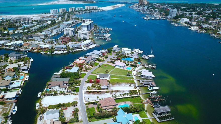 Prime location on the Destin Harbor. This is one of the few remaining vacant homesites available on Holiday Isle. Just over a third of an acre in size, this property offers an existing deep water boat dock, making this an ideal location to enjoy a boater's paradise. Enjoy fantastic views with deep water access and close proximity to the Gulf and beach access. With its iconic restaurants, hotspots, and year-round events, the Destin Harbor has something for everyone, and the location of this property provides convenient access to it all.