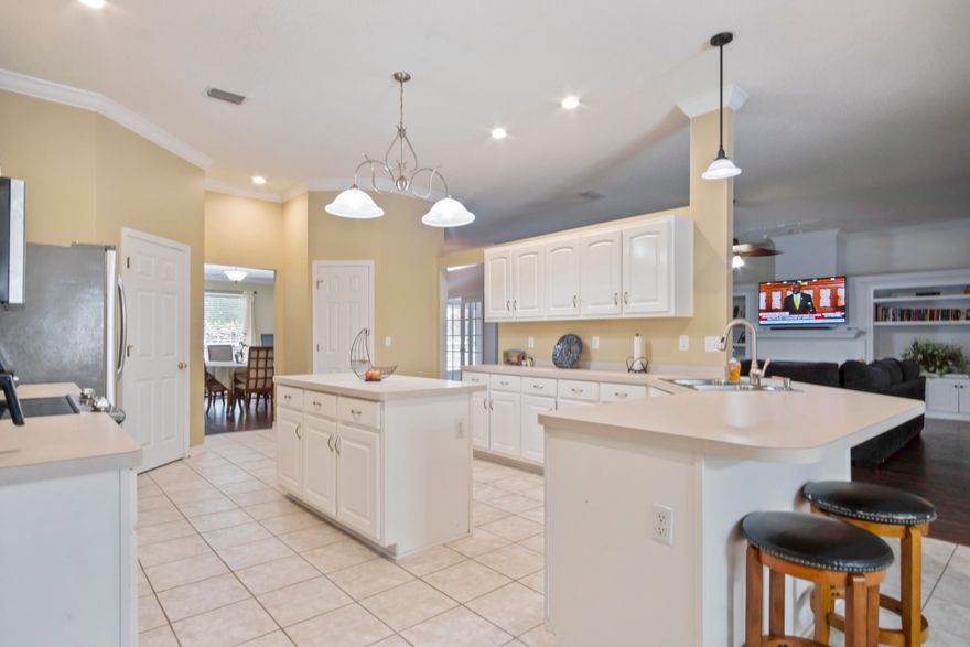 STOP, STOP, STOP!!! STOP Looking now... this beautiful large all brick home is located in the very popular Neighborhood of Silver Oaks. This neighborhood had sidewalks, which in north Crestview is hard to come by. This home offers a private pool, but the neighborhood also offers a community pool, picnic area and playground as well. Silver Oaks is just a few minutes walk to schools and shopping and a fast commute to I10 and military bases! This home has an in ground pool, huge screened porch, fenced yard, 4 bedrooms, 3 baths and 3020 sq. ft of heated/cooled area! You will love the large great room with built in bookcases, gas fireplace, and vaulted ceilings. Off the great room is the light and open kitchen with breakfast bar, is land, and eat in area.