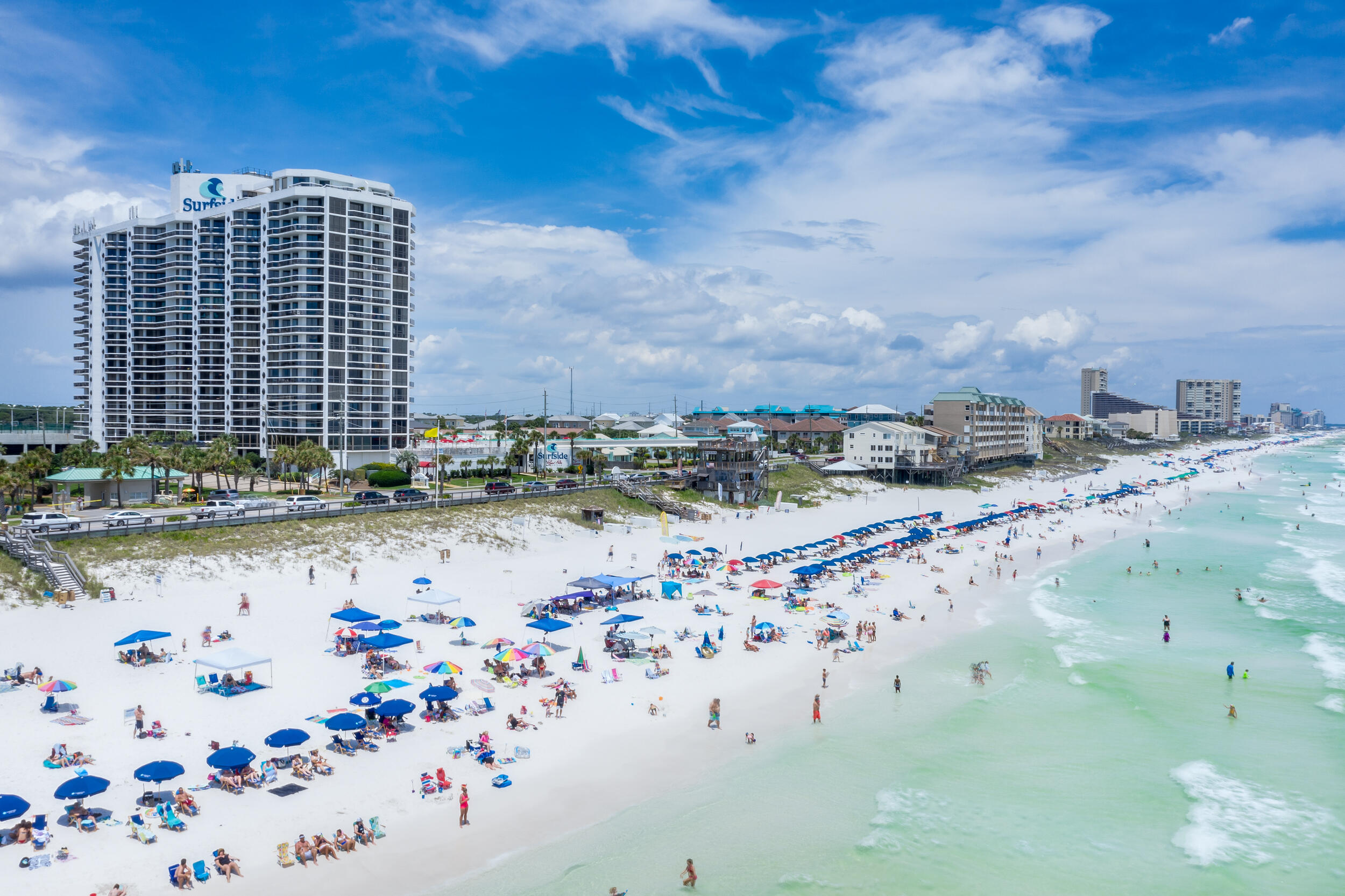 2BR/2BA Gulf-view condo at Surfside Resort. Enjoy updated kitchen and bath cabinets and granite countertops, a spacious primary suite with king bed and oversized balcony with seamless Gulf views with clear railings. Sleeps 7 with guest bunk beds ad queen fold out couch. Perfect as a rental or full-time residence, with climate-controlled corridors and covered parking. Resort living includes a heated pool, kids' pool, and multiple spas, plus a tiki hut serving food and drinks poolside. Stay active with tennis, basketball, shuffleboard, and a full fitness center, or relax at the onsite restaurant, sundry shop, salon, or massage studio. BBQ grills, conference room, a bathhouse, and deeded beach access complete the experience. Walk to dining, shopping, and entertainment.
