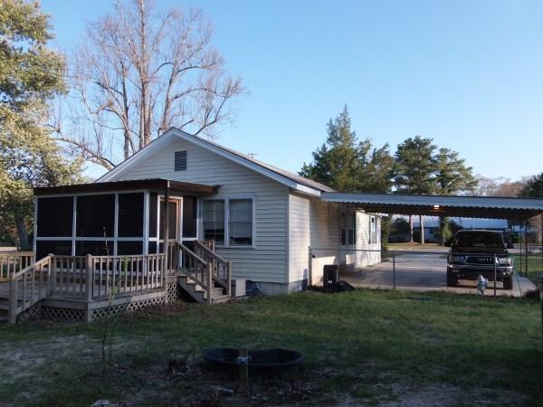 Adorable Florida cottage near the historic district and only a couple blocks to Walton Middle School and the circle at Lake Defuniak. This cozy home is located in a very desirable area in town and sits on a nice corner lot. Lot is fenced and has storage building, as well as screened front and back porch and open deck at back. Schedule your showing today!