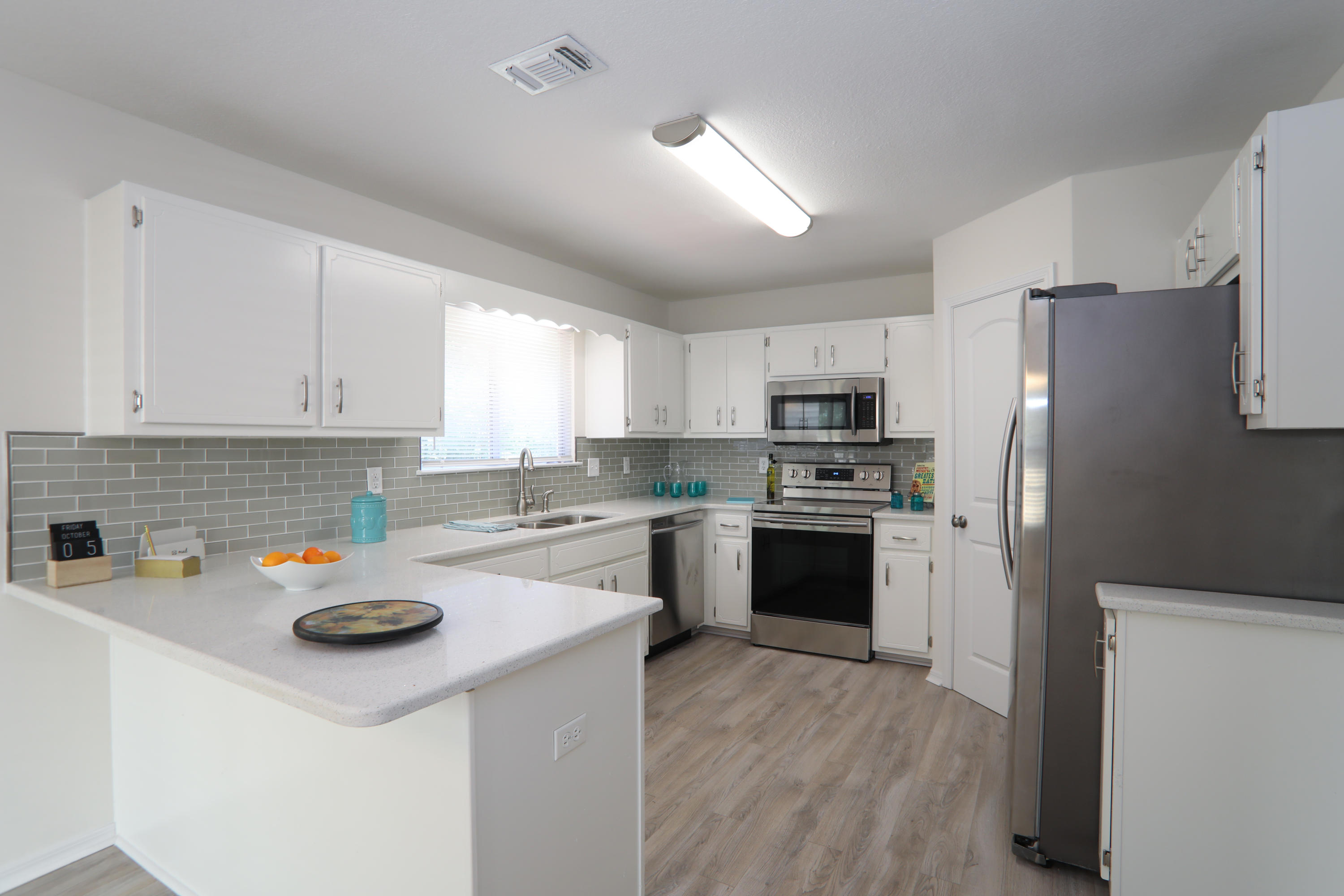 This move-in ready home has been fully updated to include new interior doors, outside AC condenser, flooring throughout, ceiling fans, light fixtures, interior paint, and all popcorn has been taken down and ceilings have been textured. The beautiful newly renovated kitchen includes granite counter tops, stainless steel appliances, new back splash, and newly painted cabinets with all new hardware. Inside the home you will find a living room with a cozy fireplace nestled in the corner, as well as a grand cathedral ceiling. Co-Agent has interest in property. Please review documents for copies of survey, elevation certificate, and insurance quotes. House elevation is 10 feet and not in flood zone.
