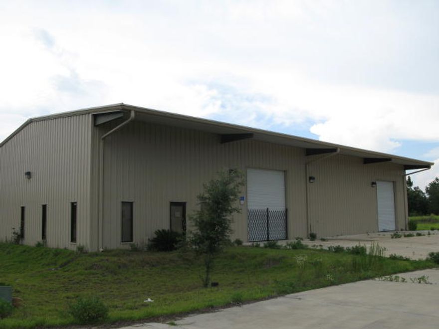 Metal warehouse building with 3 rollup doors, approx. 900 sqft is office with reception area, 2 private offices, break room and shower.