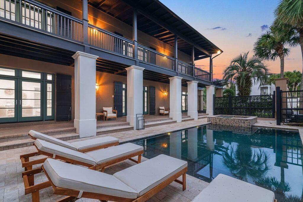 ***SUPERB LOCATION & STUNNING RENOVATION*** Located in the vacation favorite gated community of DESTINY EAST, just minutes from the gulf, this gorgeous beach villa (Sleeps 20) has MULTIPLE living & ENTERTAINING areas, five BR's in the main house, with three being primary BR's with ensuite baths, plus 2nd floor bunk rm, and additional oversized third floor bunk room & den with spiral staircase. Separate apt. or guest suite in the detached carriage house. Huge GOURMET eat-in kitchen/new stainless appliances/tile backsplash/granite island, two enormous, picturesque, covered porches, lush landscaping/ extensive outdoor lighting, brand new INGROUND POOL and HOTTUB, outdoor concrete grill, & full house generator. New roof in 2023. Summer rental calendar can transfer to new owner!