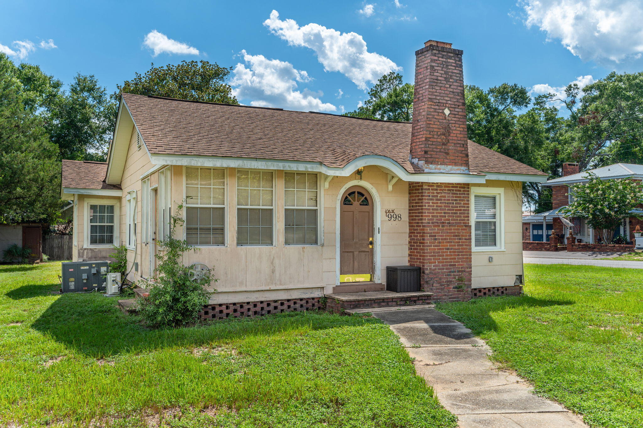***CASH ONLY***MIXED USE ZONING***This charming Florida Cottage design has an advantage over most ''AS IS'' ''INVESTOR'' homes on the market...while there is much work needed, the majority of the materials are there for you, included! This house can be occupied nicely as you design & put together your dream home or office! Situated on a corner lot, within close proximity to local restaurants & the downtown district. Main home has 2 bedrooms w/1 bath. Garage apartment is 1 bedroom/1 bath. Give us a call for more details or better, call for an appointment to see!